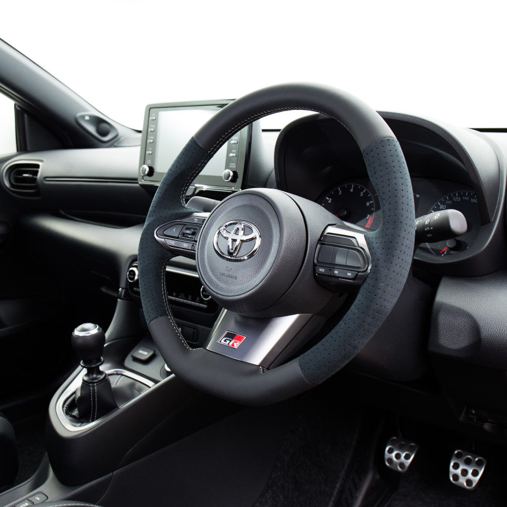 REAL ORIGINAL SERIES SOFT D SHAPE BLACK LEATHER & BLACK ULTRA SUEDE SILVER X BLACK EURO STITCH STEERING WHEEL FOR TOYOTA GR COROLLA GZEA14H  TYI-ALC-SL