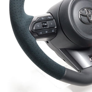 REAL ORIGINAL SERIES SOFT D SHAPE BLACK LEATHER & BLACK ULTRA SUEDE SILVER X BLACK EURO STITCH STEERING WHEEL FOR TOYOTA GR COROLLA GZEA14H  TYI-ALC-SL